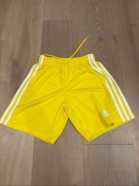 Adidas Kids Size S (9-10A) Yellow Athletic Shorts with White Three-Stripes.